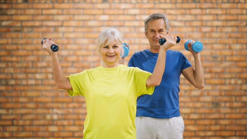 elderly-couple-working-out-in-gym