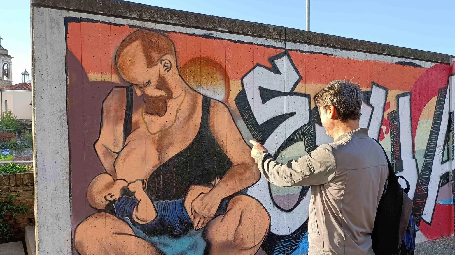 Rimini - Murales - uomo che allatta