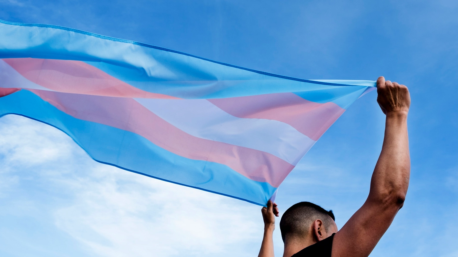 young person with a transgender pride flag