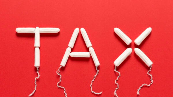 Clean Tampons Forming the Word TAX on a Red Background