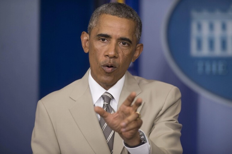 Obama e il suo "tan suit" nel 2014 (ANSA)