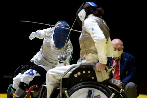 Italy's Beatrice Vio (L) competes against Russia's Ludmila Vasileva in the wheelchair fencing women's foil individual category B semi-final bout during the Tokyo 2020 Paralympic Games at Makuhari Messe Hall in Chiba on August 28, 2021. (Photo by Behrouz MEHRI / AFP)