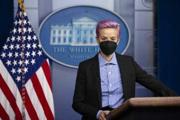 epa09094517 US soccer player Megan Rapinoe stands at the podium during a visit in the James Brady Press Briefing Room of the the White House in Washington, DC, USA, 24 March 2021.  EPA/MICHAEL REYNOLDS / POOL